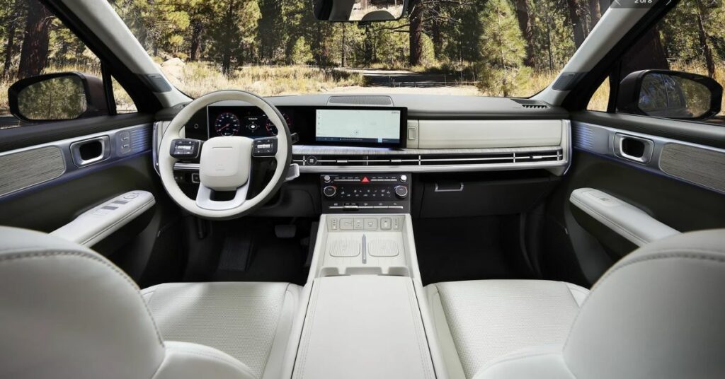 SUV interior from the driver's perspective, showing dashboard, touchscreen, and center console.