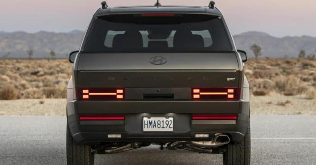 The rear view of a brown SUV with unique taillight design.