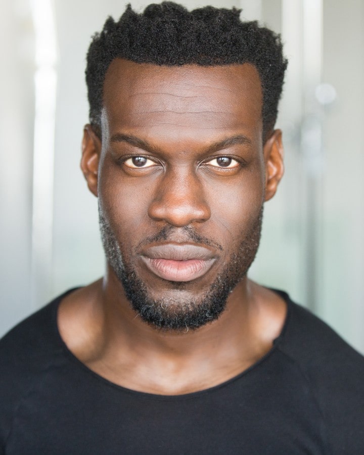 Headshot of Ansu Kabia, a male actor with a focused expression.